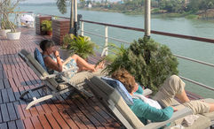 The sweeping sun deck on the Raj Mahal is lined with comfortable seating.
