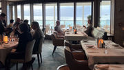 Floor-to-ceiling windows bring the outside inside in La Terrazza, the ship's main dining room.