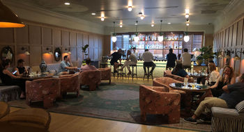 The lobby at the Palihouse Hyde Park Village doubles as a bar and a gathering space.